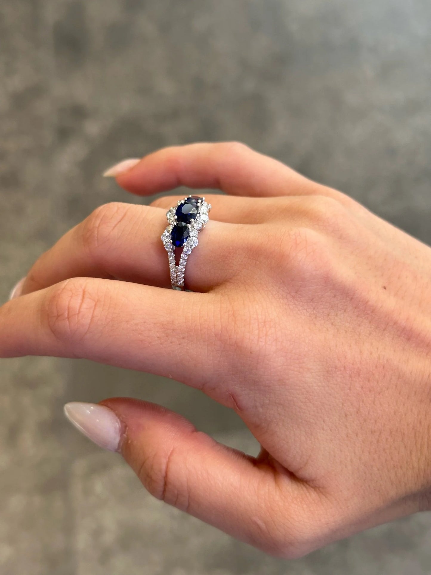 Ladies Three Stone Sapphire and Round Diamond Ring with a Split Shank