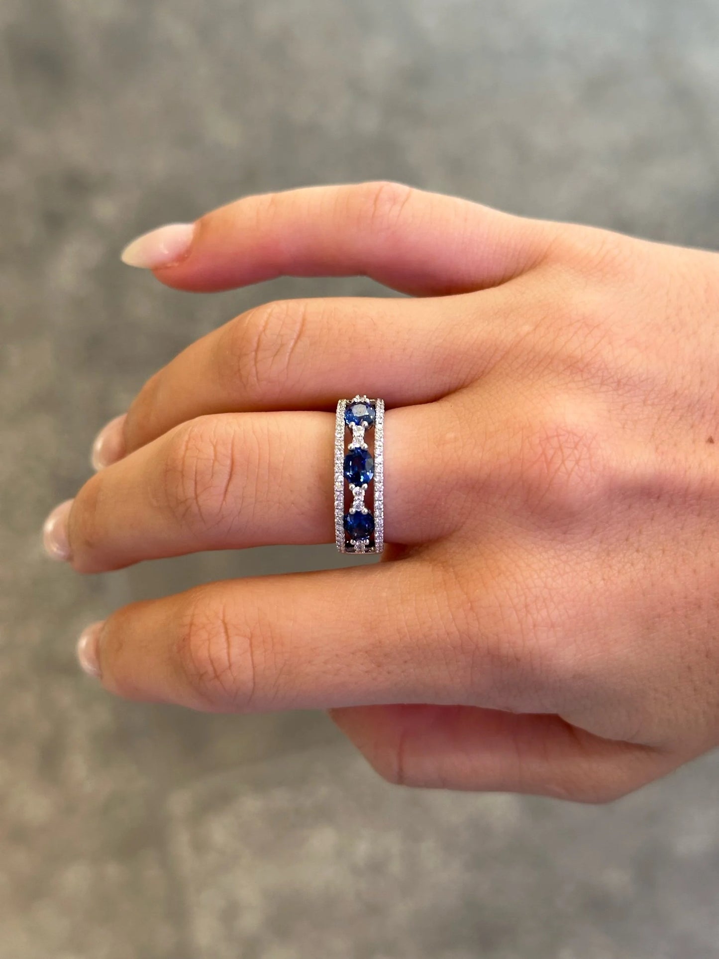 Ladies Three Stone Sapphire and Round Diamonds Band