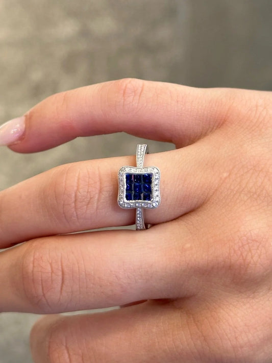 Ladies Princess cut Sapphire and Halo Round Diamond Milgrain Ring