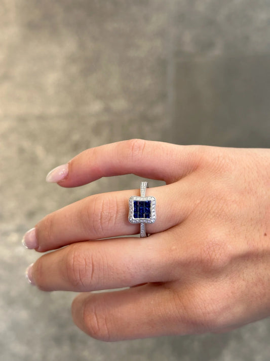 Ladies Princess cut Sapphire and Halo Round Diamond Milgrain Ring