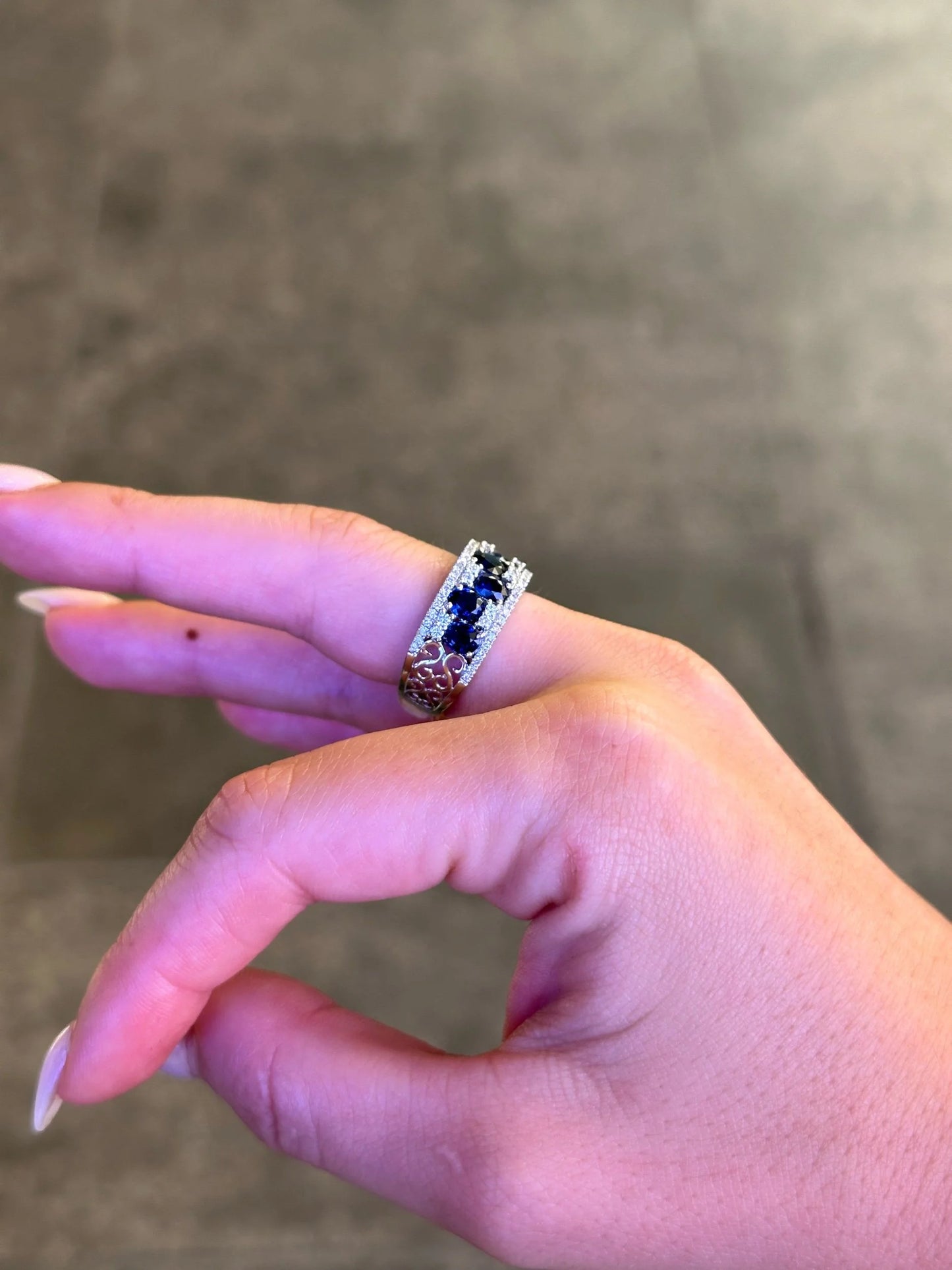 Ladies Seven Sapphire Stone Round Diamond Ring