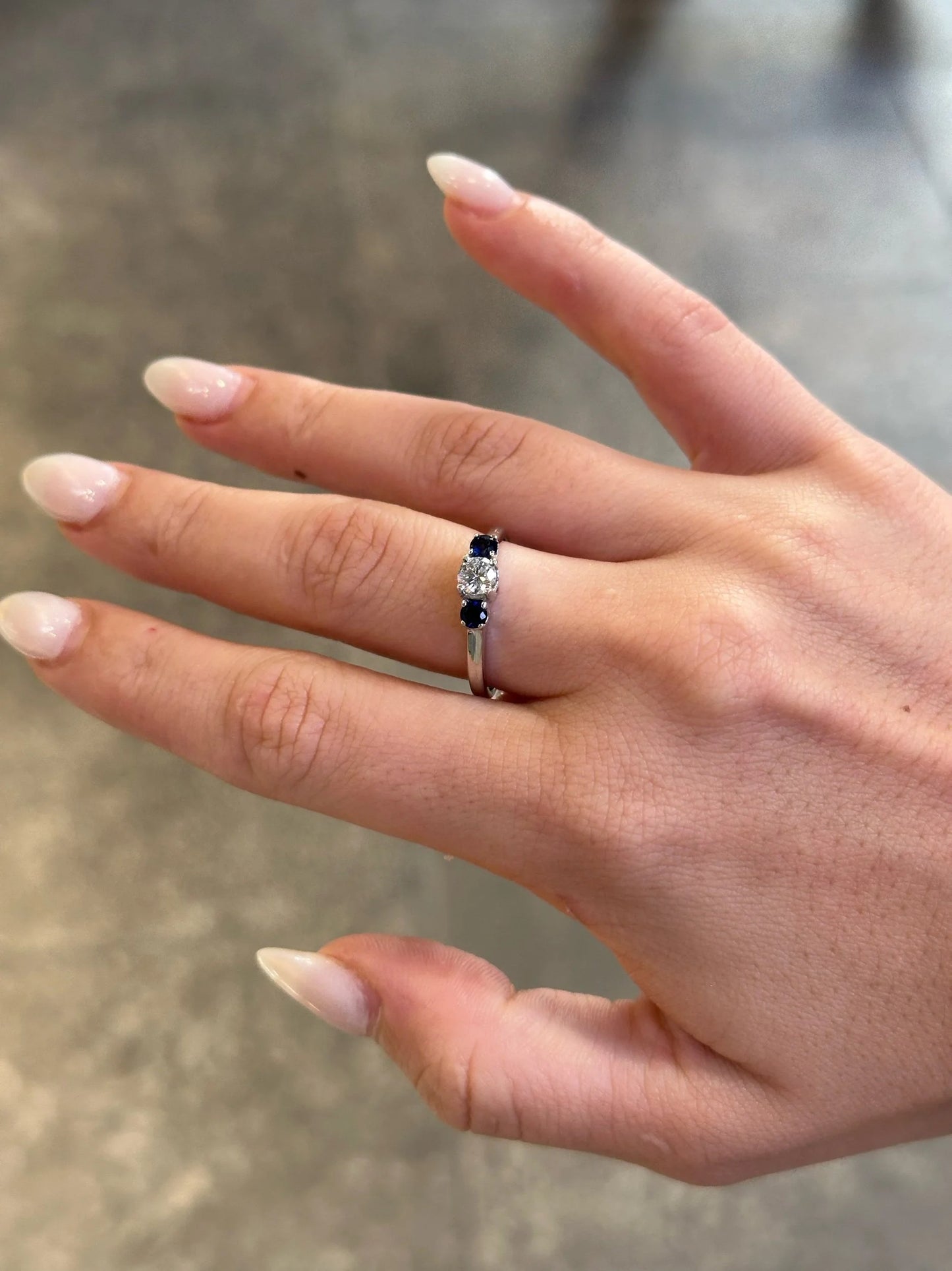 Ladies Sapphire Stone and Center Round Diamond Ring
