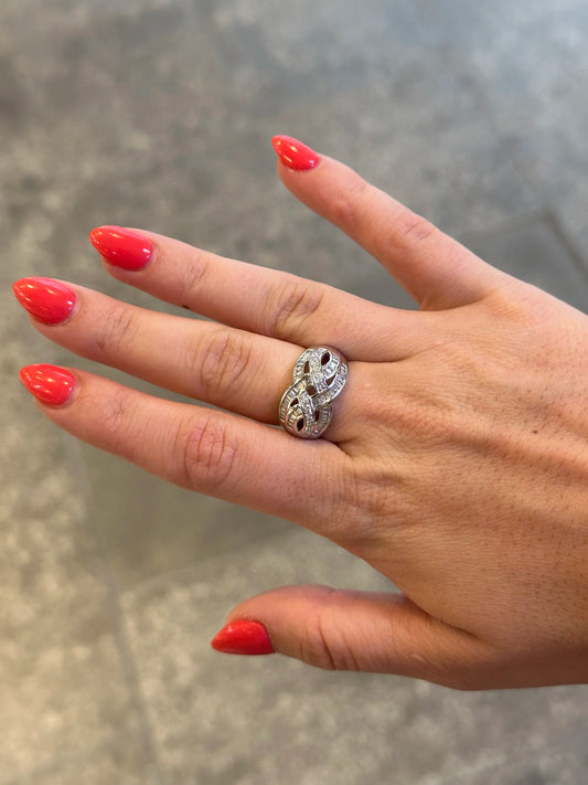 Ladies Intertwining Baguette and Round Diamond Ring