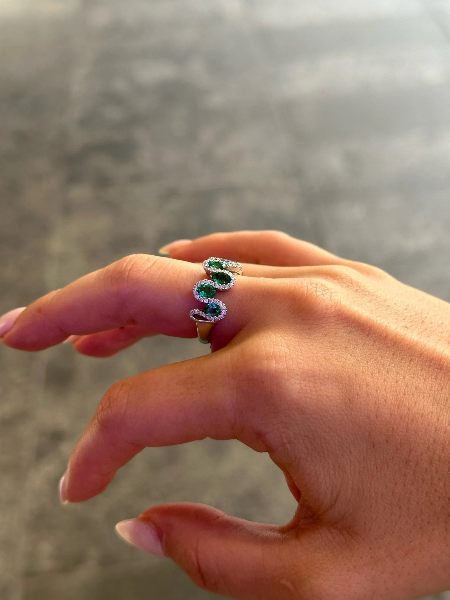 Ladies Seven Emerald Stone Round Diamond Ring