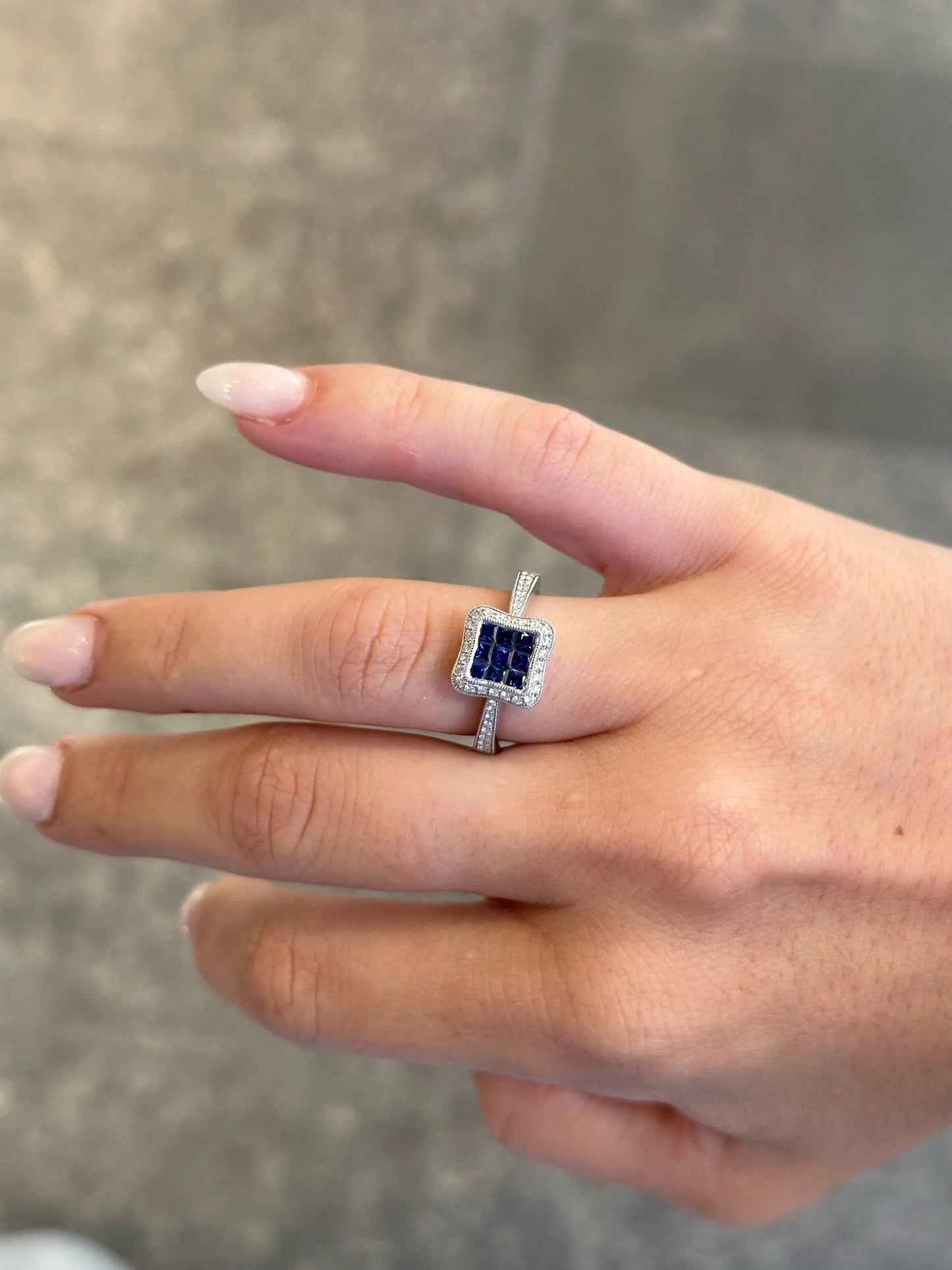 Ladies Princess cut Sapphire and Halo Round Diamond Milgrain Ring