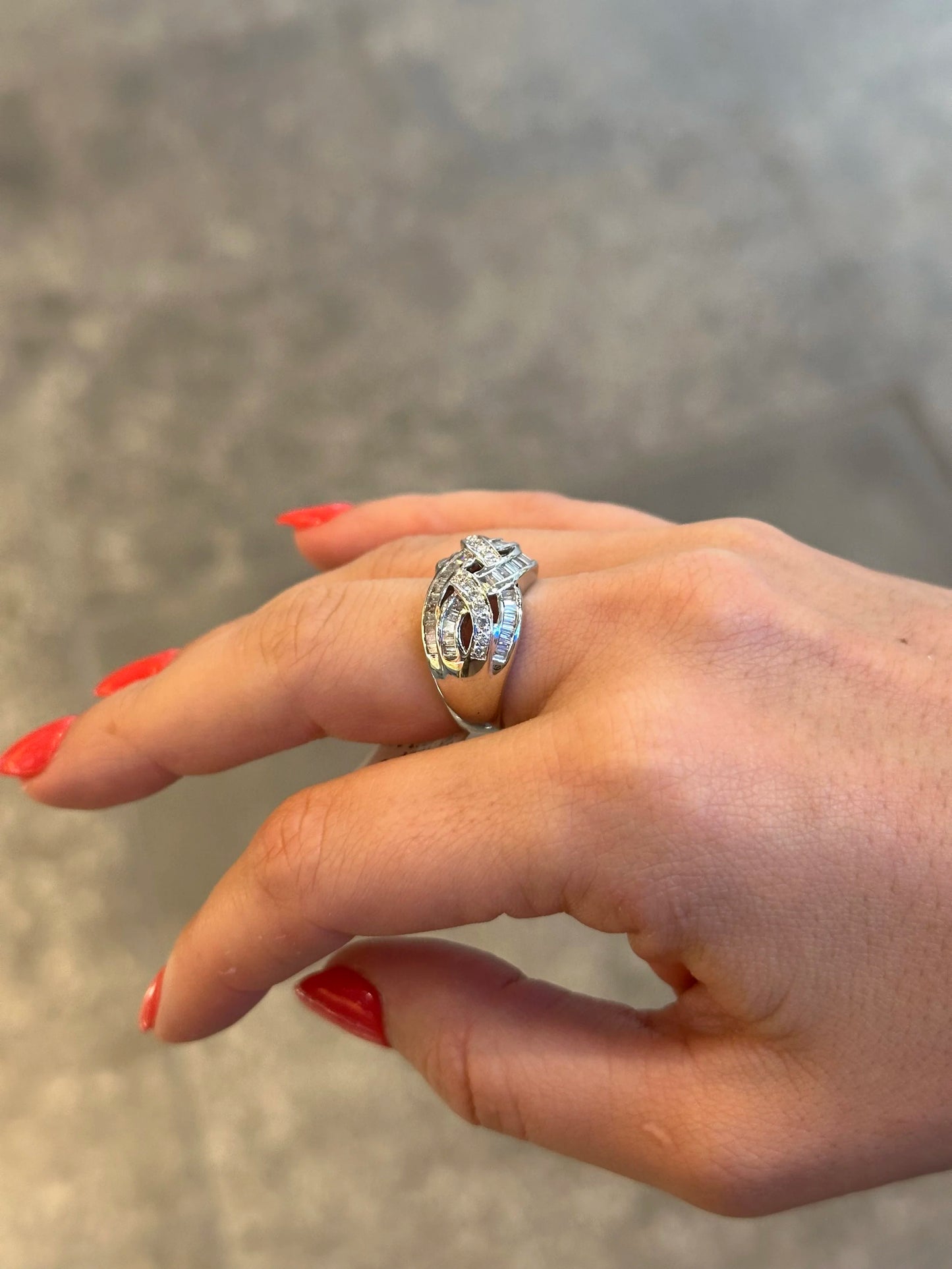 Ladies Intertwining Baguette and Round Diamond Ring